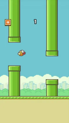 Flappy Bird mid-game with the bird between two pipes.